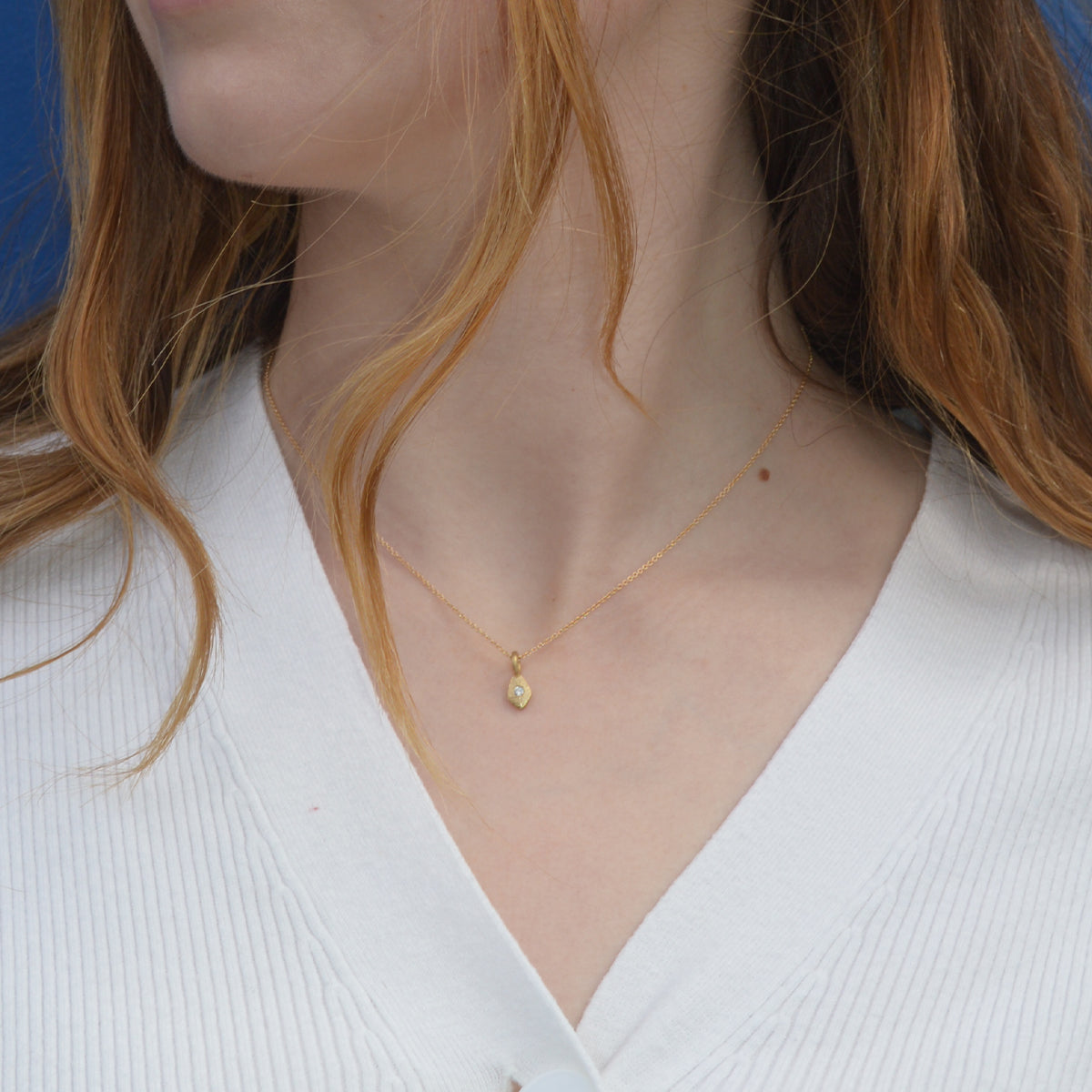 Tiny Santos Charm with diamond on model