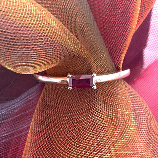 Ruby baguette ring on fabric